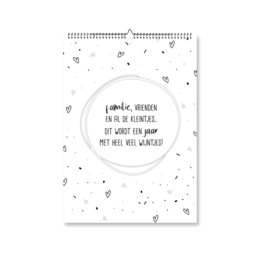 A4 sized birthday calendar with a circular design and inspirational quote. The calendar features a minimalist black and white color scheme with decorative elements like stars and dots.