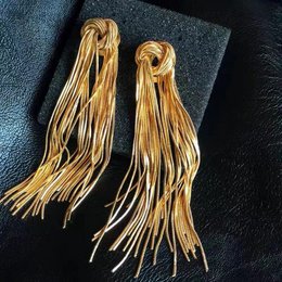 Pendientes largos con borlas y nudos vintage modernos