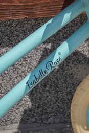 Balance bike in pastel blue color with wicker basket Isabelle Rose