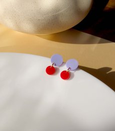 Big Dotty acrylic earrings in lilac red