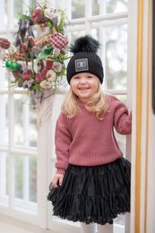 Pink knit hat with faux fur pom-pom, black knit hat with faux fur pom-pom, pink and black knit hats for girls aged 2-8 years.