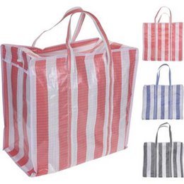  A large, reusable shopping bag with vertical red and white stripes. The bag has two sturdy handles and appears to be made of a durable, mesh-like material. This versatile tote bag would be suitable for carrying groceries, beach items, or other everyday essentials.