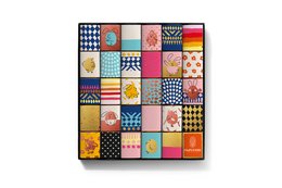 A colorful assortment of chocolate boxes in dark chocolate 72% and milk chocolate 35% varieties, featuring various patterns and designs on the packaging.