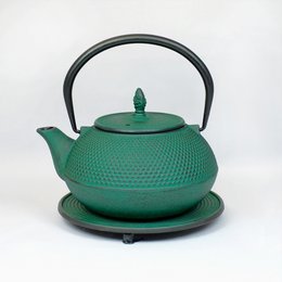 A cast iron teapot in a vibrant green color, with a capacity of 1.2 liters. The teapot features a textured, dotted pattern and a sturdy handle for easy pouring.
