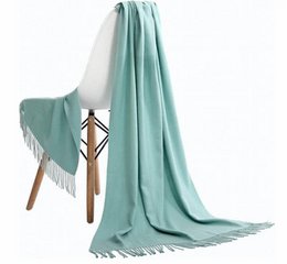 Pashmina scarf in dark mint green color, made of soft, warm material, perfect for adding a touch of elegance to any outfit.