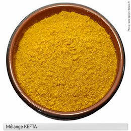 Kefta - spice and flavoring mixture - eco recharge, 45g - s, 110g - M, 220g - L, 440g - XL, 880g - Pro. A vibrant yellow-orange spice mix in a wooden bowl. The product is a spice mix for seasoning and flavoring.