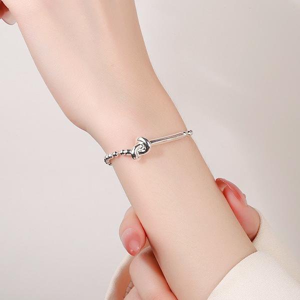Bracciale con catena a sfere e design con nodo in argento
