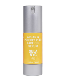 Argan and prickly pear face serum in a silver bottle. The serum is designed to nourish and hydrate the skin.