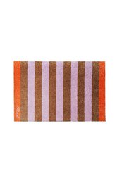 Rectangular bath mat in shades of orange and brown with vertical striped pattern.