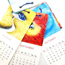 A colorful mini wall calendar for 2024 featuring illustrations of tiny houses in various natural settings and landscapes.