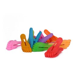  Assorted colored paper clips with a clamp base.