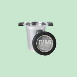 Stainless steel tea strainer with "Tea Bar" logo. Ideal for brewing loose leaf tea.