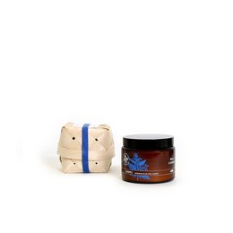 Large, round, cream-colored wax candle with blue stripes. Scented candle in a glass jar with a dark label featuring a butterfly design.