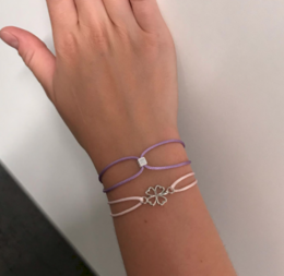  Bracelets with purple and pink beads, featuring an initial charm and a flower charm.