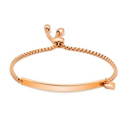 Rose gold stainless steel charm bracelet with engraved bar detail.