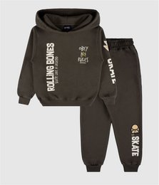 Dark gray hoodie and jogger set with "Rolling Bones" text print, skull graphic, casual kids tracksuit.