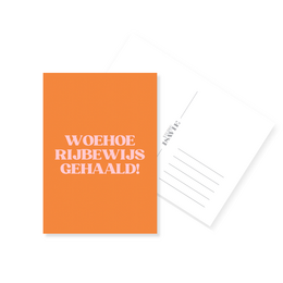 Orange congratulations card with white text "Woehoeee rijbewijs gehaald" driving license celebration Dutch