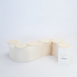 Foldable white paper bench with modular design, available in 150cm and 300cm lengths.