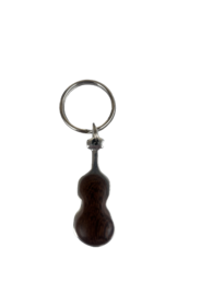 A small, black guitar-shaped keychain with a metal ring.
