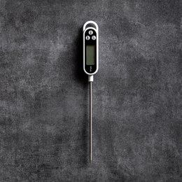 Digital kitchen thermometer with LCD display and temperature probe for precise cooking and baking.