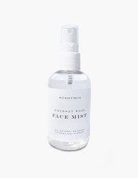 A clear, rose-scented face mist in a white bottle with a spray pump.