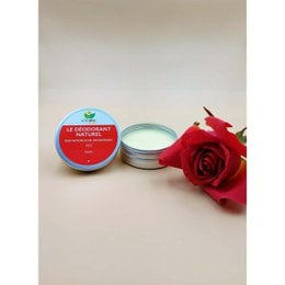 Rose-scented deodorant in a round tin container with a red rose flower.