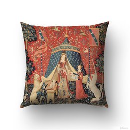 Decorative cushion cover featuring a medieval lady and a unicorn in a tapestry-style design. The cover is made of high-quality materials and features vibrant colors and intricate patterns.