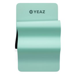 A rectangular yoga mat in a light green color with the Yeaz logo printed on it. The mat appears to be made of a durable, high-quality material suitable for yoga and fitness activities.
