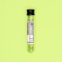  Green glittery face makeup product. Shimmery, sparkly, eco-friendly makeup.