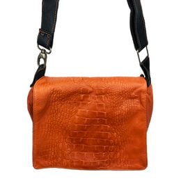 Shoulder bag in orange crocodile print leather with adjustable strap.