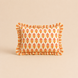  Rectangular cushion with a vibrant floral pattern in shades of orange, yellow, and blue. Features a ruffled edge for a decorative touch.