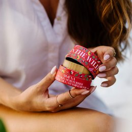 A moisturizing cream for dry skin, with a red and yellow packaging featuring a snake logo. The cream is designed to hydrate and nourish the skin.