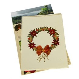 Greeting card with a wreath of wildflowers and a red bow. The wreath is made of various autumn-colored leaves and flowers, creating a natural and rustic design.