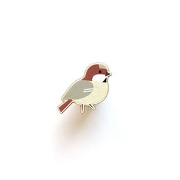 Colorful wooden brooch in the shape of a tit bird, featuring a blue and yellow design.