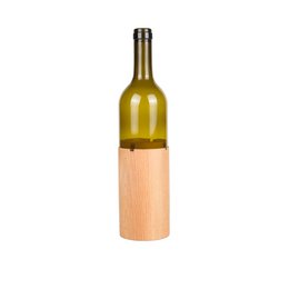A round, tall glass bottle candle holder with a wooden base. The bottle is made of glass and has a yellow-green color, and the base is made of light-colored wood.