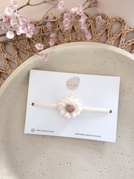  Lilac-colored wool flower hairband for kids, featuring a delicate floral design.