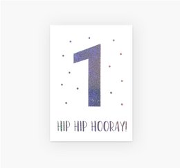 A postcard with the number 1 and the text "Hip hip hooray!" in a stylized font, with a small heart icon. This limited edition birthday card celebrates the first year of an occasion.