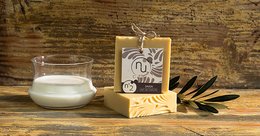 This image shows a bar of N2 Goat's Milk Solid Soap. The soap is a rectangular shape with a white and brown color. It is displayed on a wooden surface along with a glass container of what appears to be milk or cream. The image also includes a small wooden sign or label with a palm tree design.
The key details that can be extracted from this image to support a semantic search are:
- Product type: Soap bar
- Ingredients: Goat's milk
- Shape: Rectangular
- Colors: White, brown
- Additional details: Wooden sign/label with palm tree design