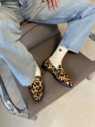 Leopard print loafer slippers, brown animal pattern, cozy house shoes, fuzzy indoor footwear.