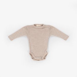 Soft, cozy baby romper in neutral beige color made from merino wool. Long sleeves provide warmth and comfort for infants.