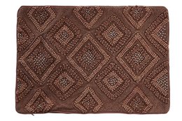 Brown cushion cover with diamond-shaped patterns and floral designs.