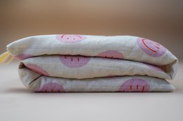 Katoenen warmtekussen gevuld met biologische spelt Smiley Pink