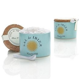 Ceramic pot containing Fleur de Sel salt from Ibiza, Spain. Includes a wooden spoon for serving. Packaged in a decorative tin with the Sal de Ibiza logo.
