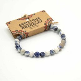 Gemstone Manifestation Bracelet - Sodalite. Beaded bracelet made with natural sodalite stones in shades of blue, gray, and white. Oval and round shaped beads.