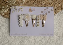 "Elegant pearl and crystal hair clips in small, medium, and large sizes for kids. Suitable for formal or casual occasions."