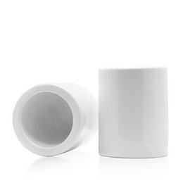 White ceramic toilet brush holder with a round design.