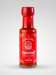 A small red bottle of Quietud Habanera sauce, a condiment product. The bottle has a red label with white text and graphics.
