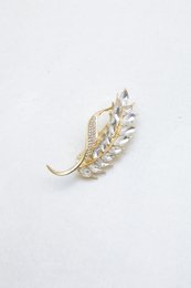 Fin messing broche