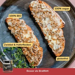 A vegan roasted pork spread made with organic ingredients. The product has a black and gold label with the brand name "Goldblatt" and the product name "Pork Taste (vegan roasted pork spread)". The spread is in a glass jar with a black lid.