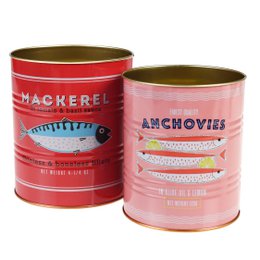 Two red and white tin cans labeled "Mackerel" and "Anchovies" containing various green herbs and plants.
The image shows two red and white tin cans labeled "Mackerel" and "Anchovies" that appear to be used as storage containers for various green herbs and plants. The cans have a vintage, retro design with bold text and graphics. This suggests the products are likely intended for storage or decor purposes, rather than containing actual mackerel or anchovies.